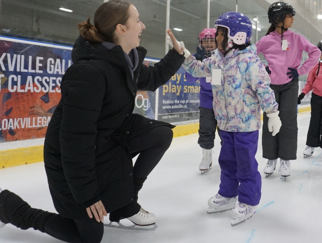 Happy skaters with an energetic coach